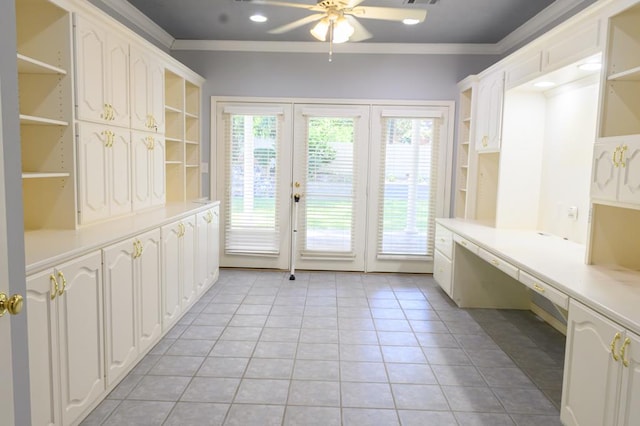 mudroom featuring built in desk, ornamental molding, french doors, a ceiling fan, and light tile patterned flooring