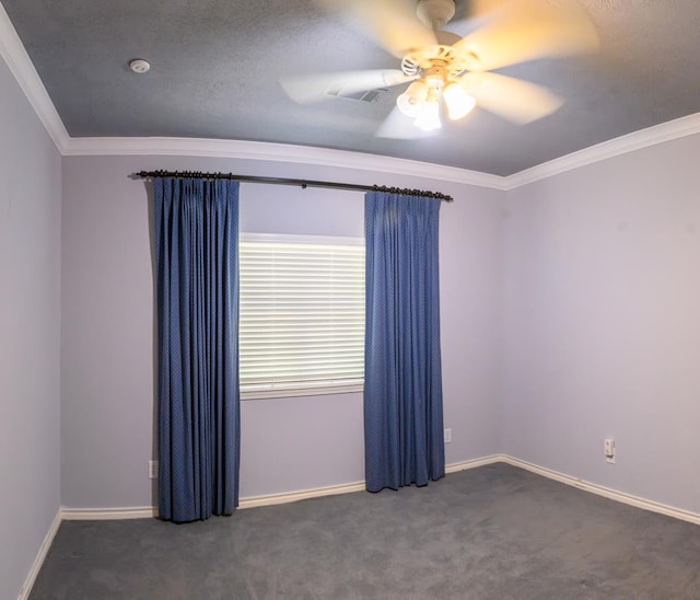 empty room with crown molding, ceiling fan, carpet, and baseboards