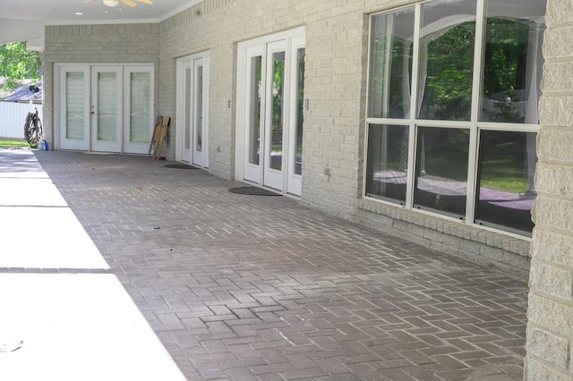 view of patio / terrace with french doors and a ceiling fan
