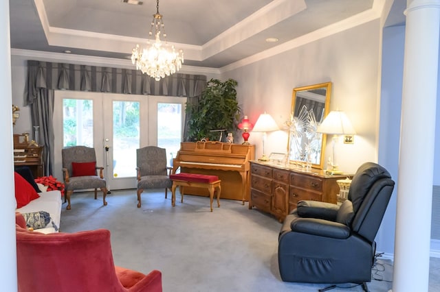 sitting room with carpet flooring, a raised ceiling, french doors, and an inviting chandelier