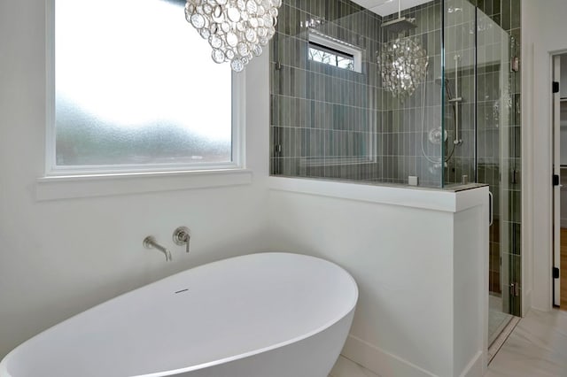 full bathroom with a freestanding bath and a tile shower