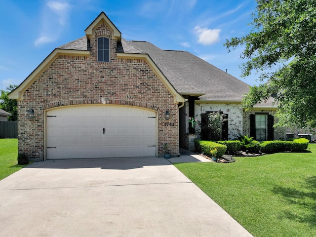 french country home featuring a front lawn