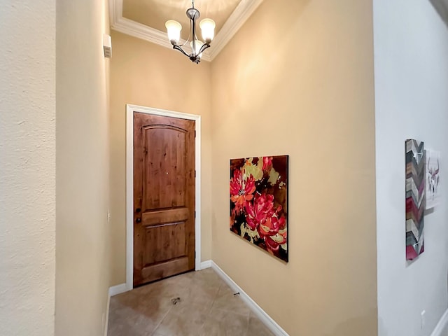 interior space featuring ornamental molding and an inviting chandelier