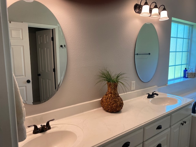 429 Derek Rd, Lufkin, TX 75904 - full bathroom featuring double vanity and a chandelier