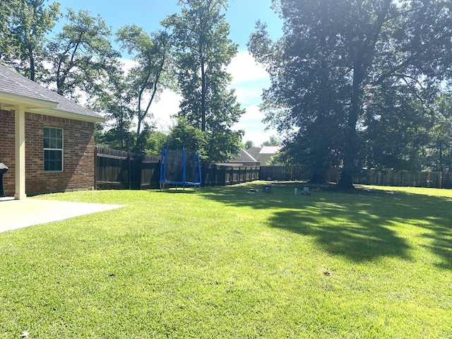429 Derek Rd, Lufkin, TX 75904 - view of yard with a trampoline and a patio