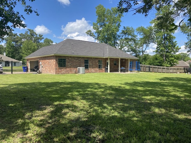 429 Derek Rd, Lufkin, TX 75904 - rear view of house with brick siding, central AC, and a shingled roof