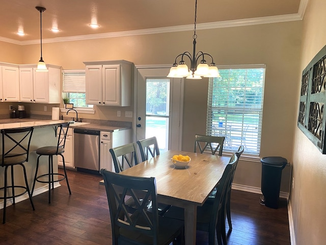 429 Derek Rd, Lufkin, TX 75904 - dining area with dark wood-type flooring, a chandelier, crown molding, and baseboards