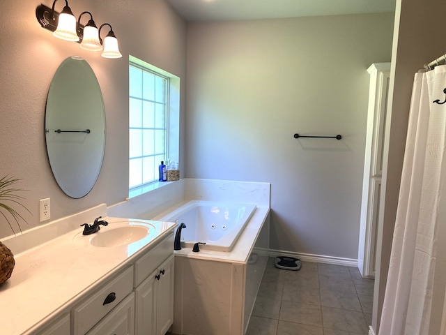 429 Derek Rd, Lufkin, TX 75904 - bathroom with vanity, a tub with jets, baseboards, and tile patterned floors