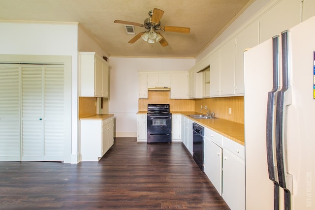 511 1st, Jasper, TX 75951 - kitchen with black appliances, ceiling fan, decorative backsplash, dark wood-type flooring, and white cabinetry