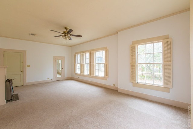 511 1st, Jasper, TX 75951 - carpeted empty room with crown molding and a ceiling fan