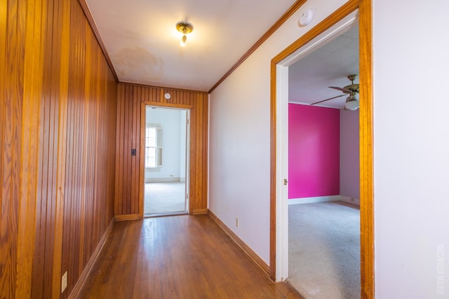 511 1st, Jasper, TX 75951 - hallway featuring wood finished floors, crown molding, and wood walls