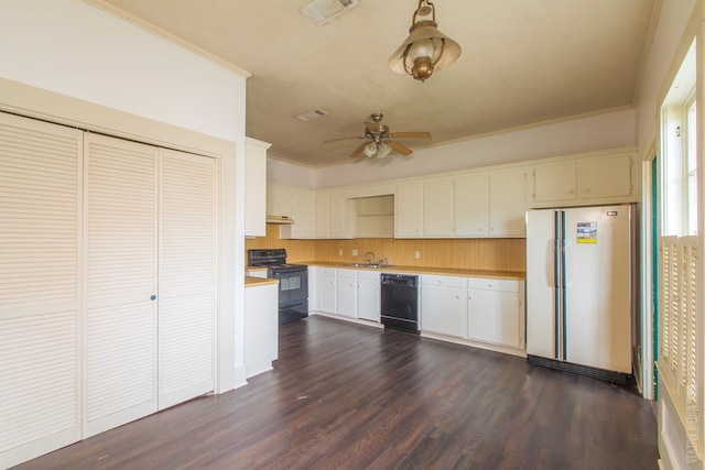 511 1st, Jasper, TX 75951 - kitchen with black appliances, light countertops, ornamental molding, a ceiling fan, and dark wood-style flooring