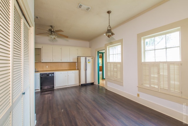 511 1st, Jasper, TX 75951 - kitchen featuring freestanding refrigerator, black dishwasher, dark wood finished floors, light countertops, and white cabinets
