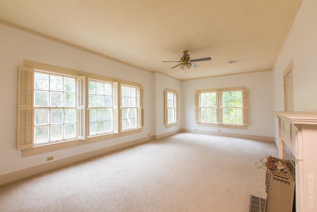 511 1st, Jasper, TX 75951 - unfurnished living room featuring ornamental molding, light carpet, and ceiling fan