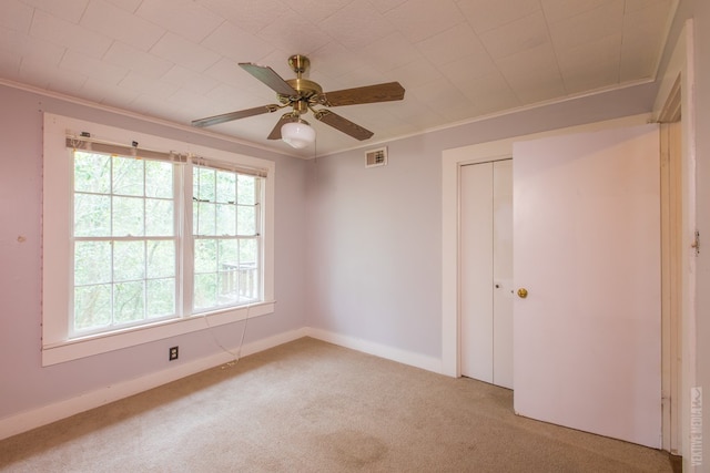 511 1st, Jasper, TX 75951 - empty room with light colored carpet, crown molding, and a ceiling fan