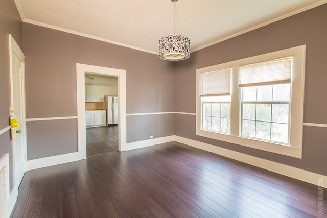 511 1st, Jasper, TX 75951 - empty room with crown molding and dark wood-style floors
