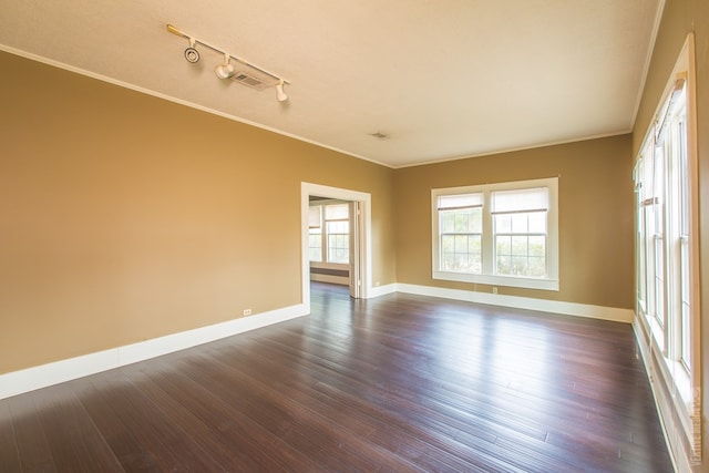 511 1st, Jasper, TX 75951 - empty room featuring dark wood-type flooring and ornamental molding