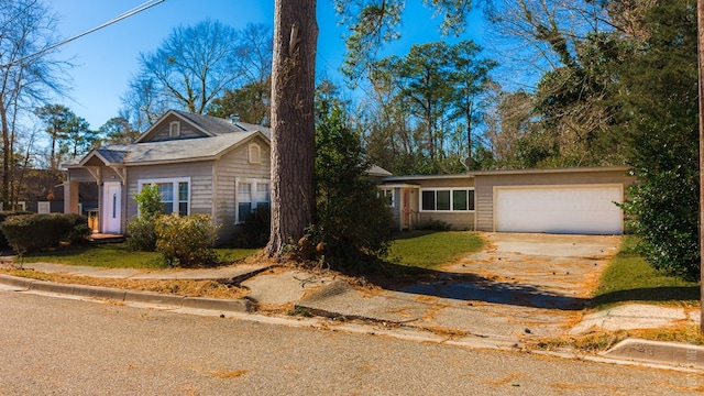 511 1st, Jasper, TX 75951 - view of front of property with driveway and an attached garage