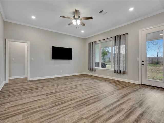 unfurnished living room featuring crown molding, ceiling fan, and light hardwood / wood-style flooring