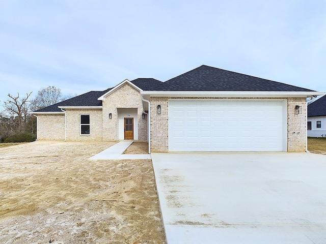 ranch-style home with a garage