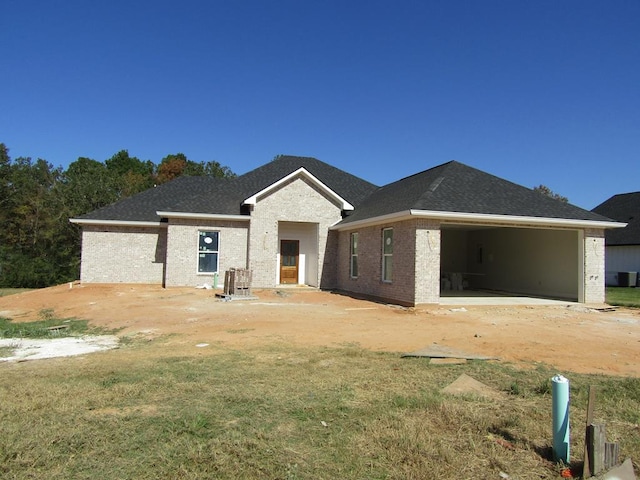 rear view of house with a garage