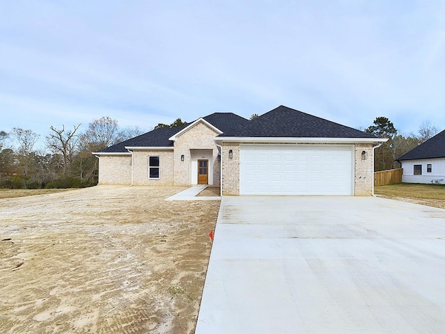 ranch-style house featuring a garage