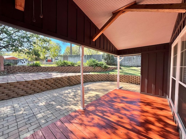 wooden terrace featuring a patio area