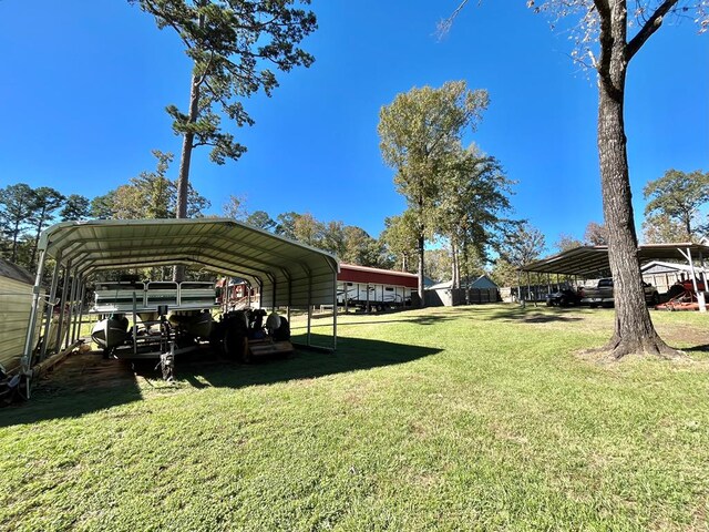 view of vehicle parking featuring a lawn and a carport