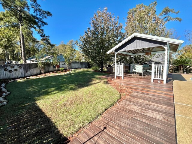 view of pool with a deck and ceiling fan