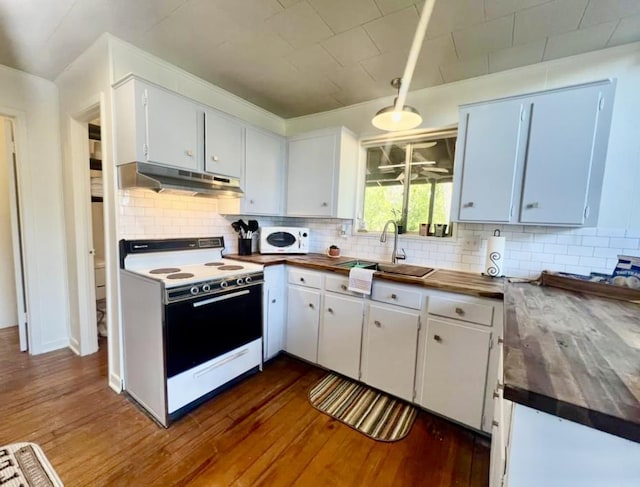 kitchen featuring white cabinetry, sink, tasteful backsplash, dark hardwood / wood-style flooring, and white appliances