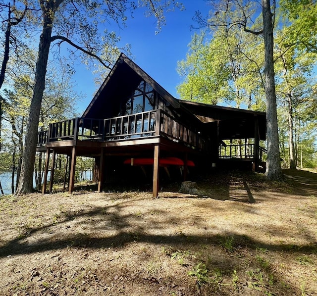 back of property featuring a deck