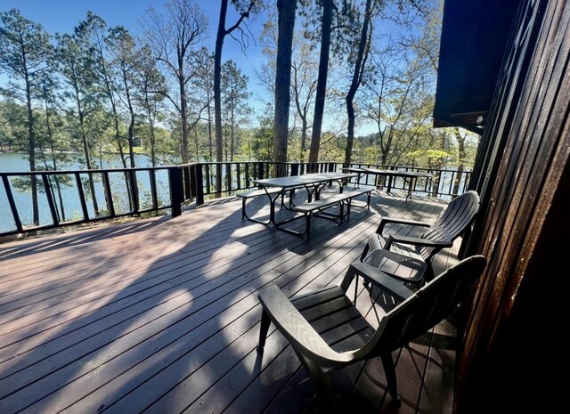 wooden deck featuring a water view