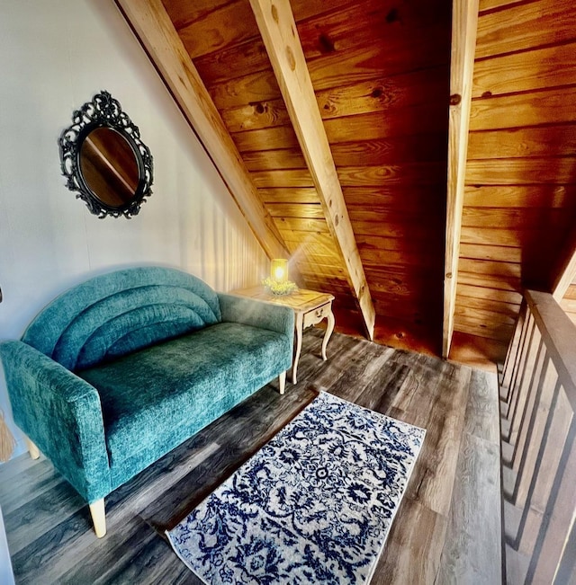 sitting room featuring beamed ceiling, dark hardwood / wood-style flooring, and wooden ceiling