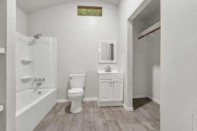 full bathroom with hardwood / wood-style floors, vanity, shower / bath combination, and lofted ceiling