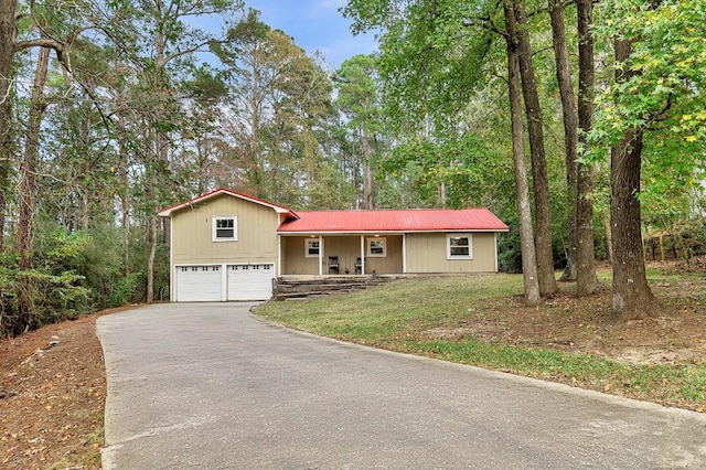 view of front facade with a porch and a garage