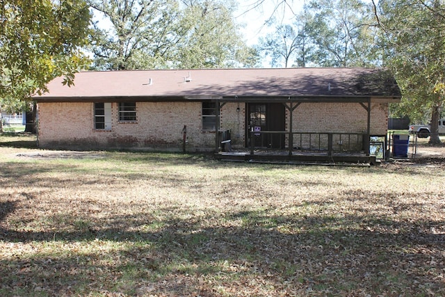 back of house with a yard