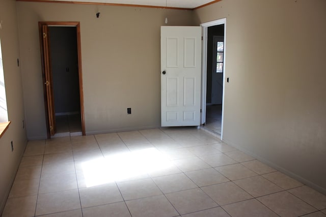 empty room featuring ornamental molding