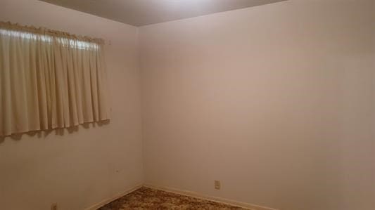 unfurnished room featuring carpet floors