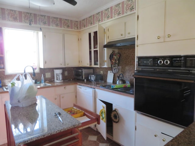 kitchen with sink, white cabinets, and black appliances