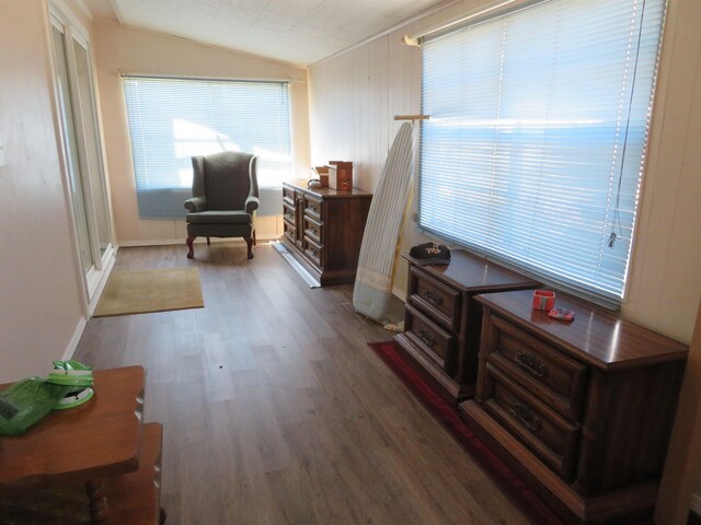 sitting room featuring hardwood / wood-style floors and vaulted ceiling