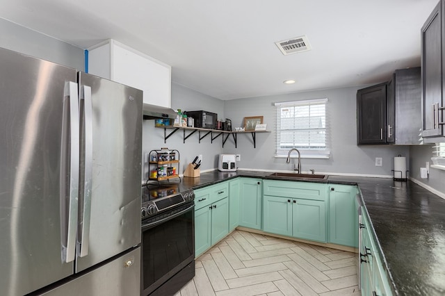 kitchen with sink, ventilation hood, range with electric stovetop, stainless steel fridge, and light parquet floors