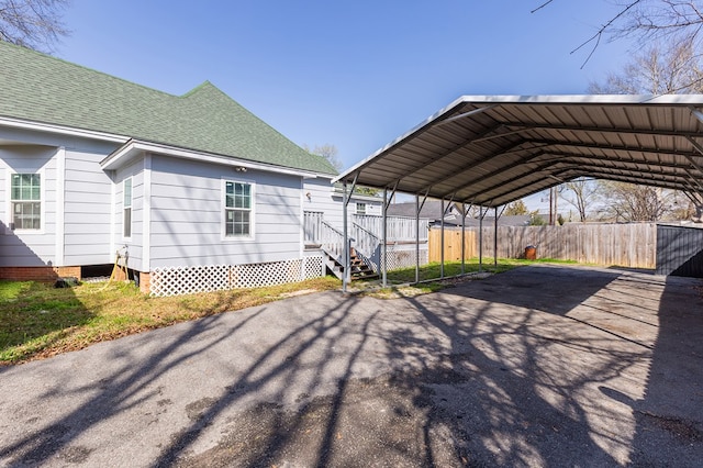 view of side of property with a carport