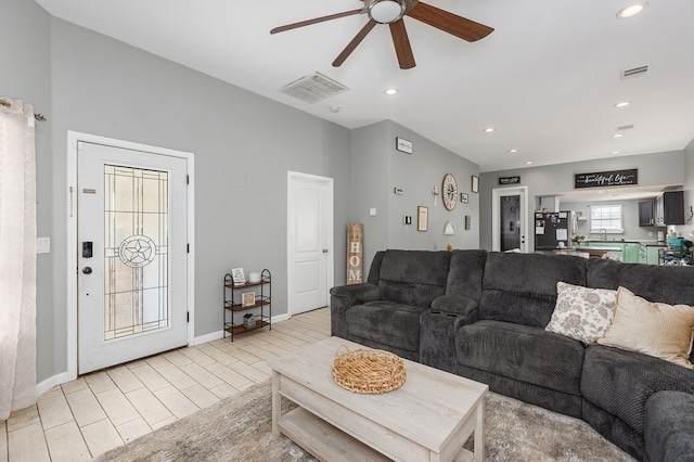 living room with sink and ceiling fan