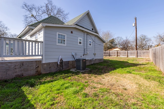 view of home's exterior featuring a yard and central air condition unit