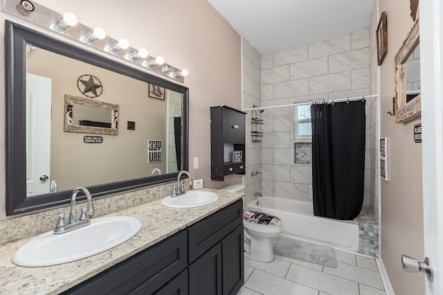 full bathroom with tile patterned floors, vanity, toilet, and shower / bath combo with shower curtain