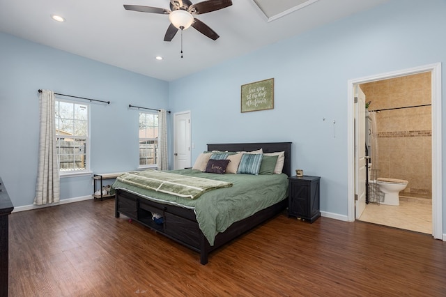 bedroom featuring connected bathroom, dark hardwood / wood-style floors, and ceiling fan