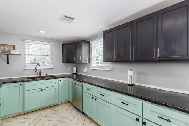 kitchen with light parquet floors, dishwasher, and sink