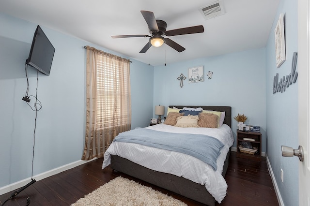 bedroom with dark wood-type flooring and ceiling fan