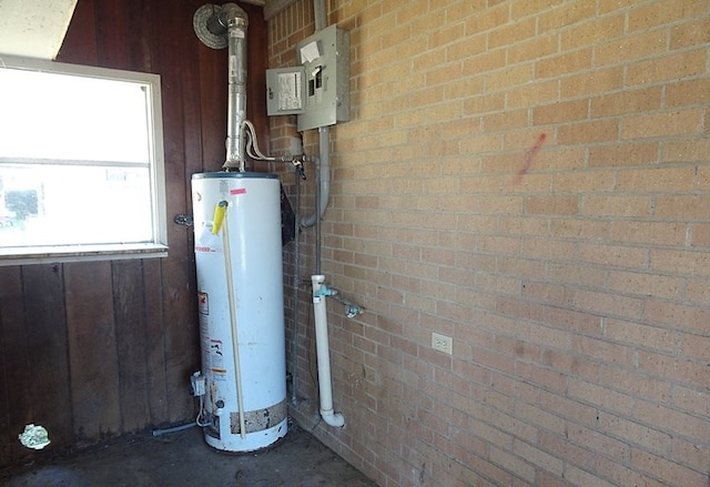 utility room with water heater