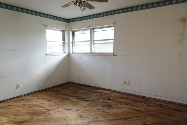 unfurnished room with a ceiling fan